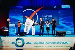 Picture of The IAPCO AM&GA flag passed from Cankarjev dom to the host PCOs for the 2025 edition